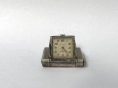 A silver Dunhill 'La Captive' purse watch