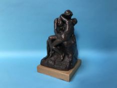A sculpture of two entwined lovers