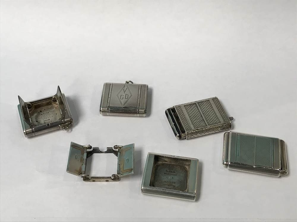 Quantity of silver purse watch cases