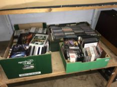Three boxes of CDs and DVDs