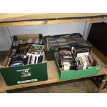 Three boxes of CDs and DVDs