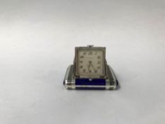 An enamelled silver Dunhill purse watch