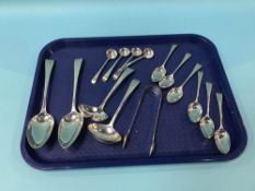 A collection of Georgian silver flatware to include four mustard spoons, six tea spoons, two table
