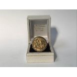 A Gents Sovereign ring and 9ct gold mount, 13g