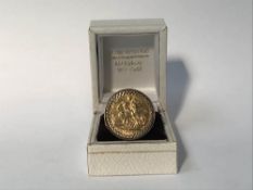 A Gents Sovereign ring and 9ct gold mount, 13g