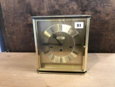 A Longines clock, with 8 day movement, chiming action, in metal case, W 22cm