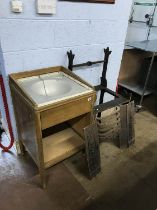 A cast iron stand and a sink unit