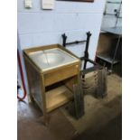 A cast iron stand and a sink unit