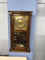 An Art Nouveau style wall clock, in the style of Charles Rennie Mackintosh, with silvered chapter