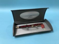 A boxed Parker marbled Sonnet ball point pen