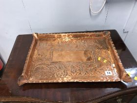 A large copper Arts and Crafts rectangular embossed tray, W 49cm