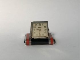 A silver enamelled Cartier purse watch