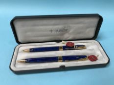A boxed pair of blue marbled Parker Sonnet ball point pens
