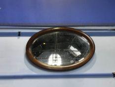 Edwardian mahogany oval mirror