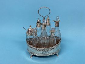 A Georgian silver cruet with seven bottles, various dates