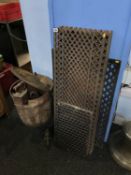 A cast iron wash tub, various flat irons and a selection of cast iron floor grills etc.
