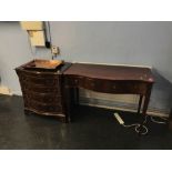 A reproduction mahogany serpentine chest of drawers and a side table