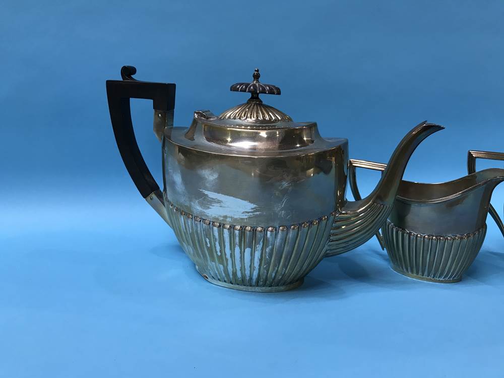 A silver three piece tea set, Walker and Hall, Sheffield, 1917, 36 ozs - Image 3 of 3