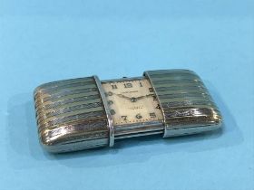 A silver Movado purse watch