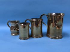 Four brass measures, quart, pint and two half pints