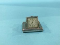A silver Dunhill purse watch