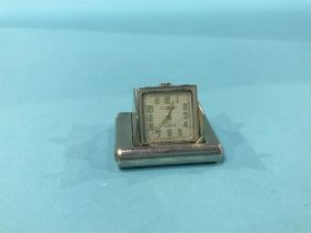 A silver Dunhill purse watch