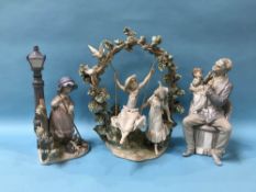 A Lladro group 'Girl in the Swing' and two other Lladro groups (3)