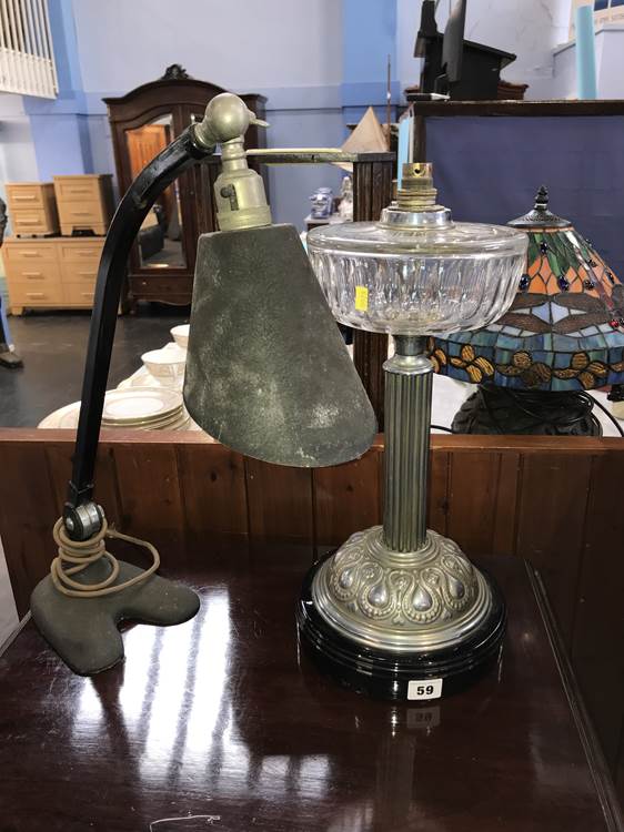 A retro angle poise lamp and an oil lamp