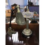 A retro angle poise lamp and an oil lamp