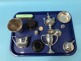 Two silver trophies, a silver cream jug etc.