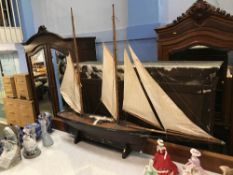 An early 20th century scratch built wooden two mast sailing boat, L 136cm, H 113cm