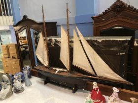An early 20th century scratch built wooden two mast sailing boat, L 136cm, H 113cm
