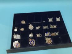 Collection of silver badges, fobs etc.