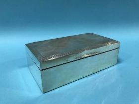 A silver cigarette box