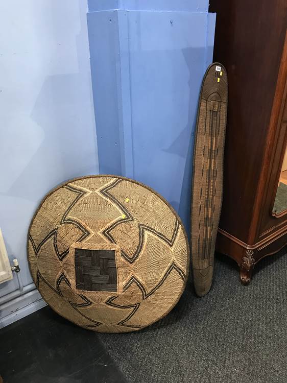 A Tribal bowl 84cm Diameter and a shield 132cm length X 20cm wide.