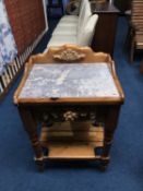 A pine and marble top side table