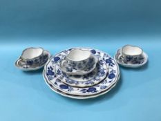 Three blue and white Meissen cups and saucers and three plates