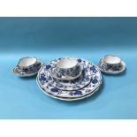 Three blue and white Meissen cups and saucers and three plates