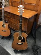 A Mugen Mark One acoustic guitar