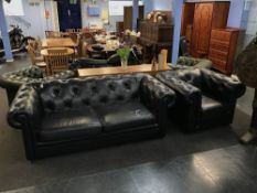 A black leather club Chesterfield armchair and a Chesterfield settee