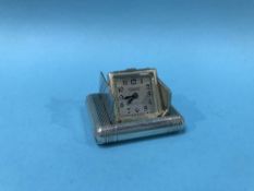 A silver Dunhill purse watch