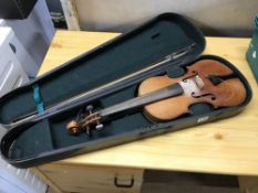 A violin and bow, in coffin case