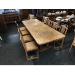 A 1970's Sid Pollard Mouseman design solid oak refectory table and a set of eight lattice back