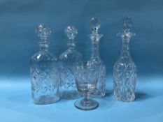 Two pairs of cut glass decanters and an etched wine glass