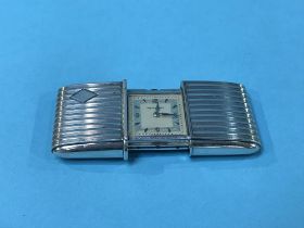 A silver Movado purse watch