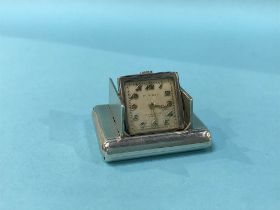 A silver Dunhill purse watch