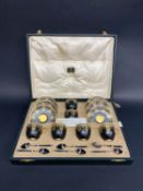 A cased Royal Worcester six setting coffee service, dated 1925, with set of six silver enamelled