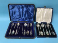 Two sets of cased silver tea spoons