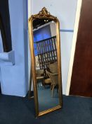 A gilt easel mirror, 175cm x 56cm