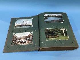 A postcard album and contents